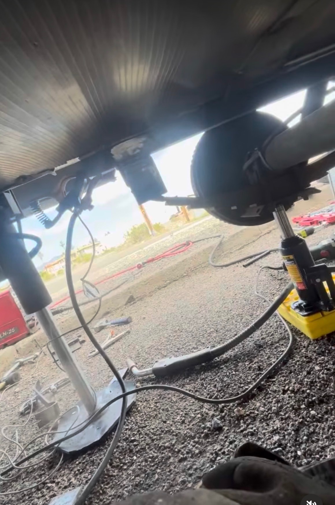 Roadside RV Axle Repair — Bottle Jack Setup