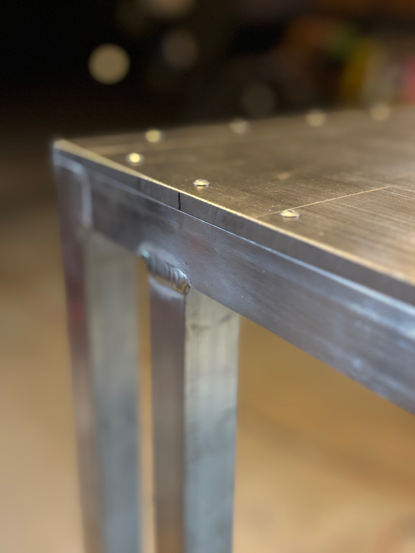 Steel Table Corner — Flush Plug Welds